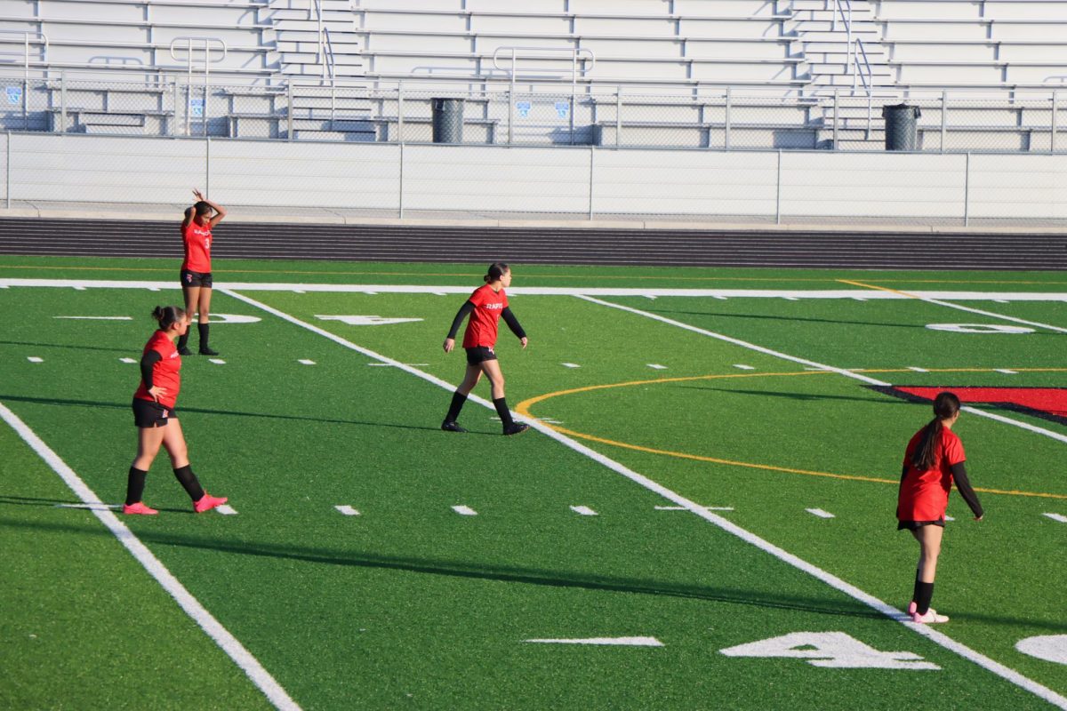 The Rocktown Soccer JV girls are getting in position before the game against Broadway starts. 
