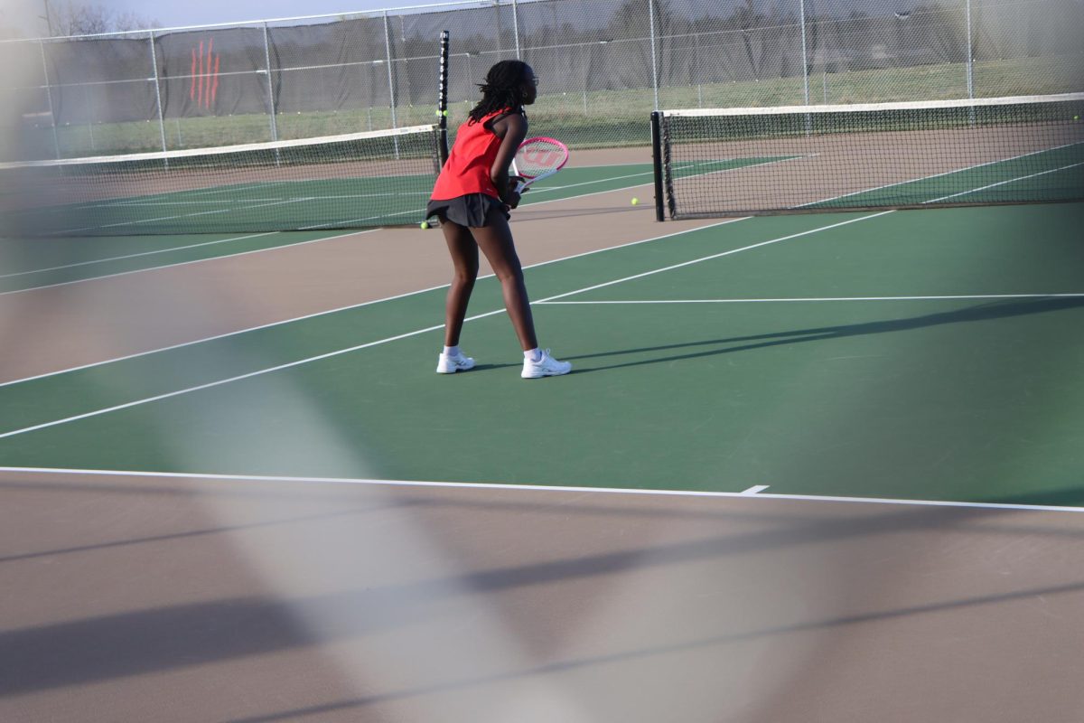 Olamitesiwaju Akinyemi gets ready to return a serve during the match.
