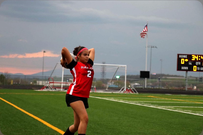 Freshman Emily Barahona makes a throw in making sure the ball goes over her head.