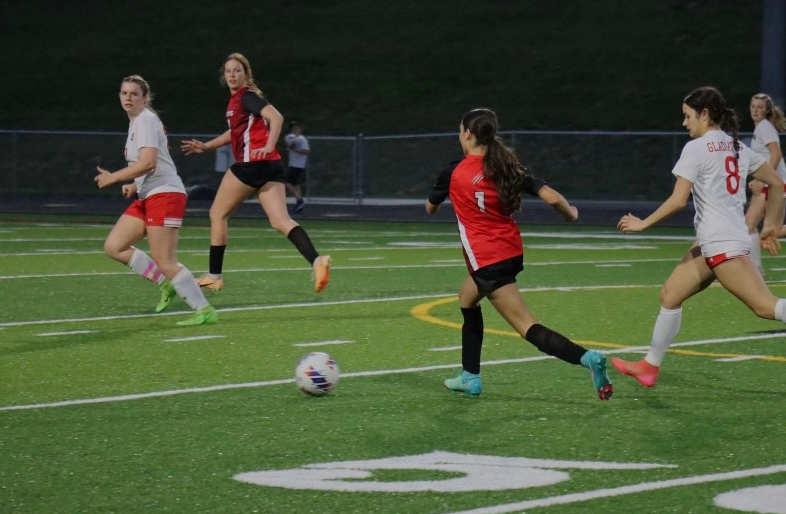 Sophomore Maryn June runs in an open space with the ball at her control.