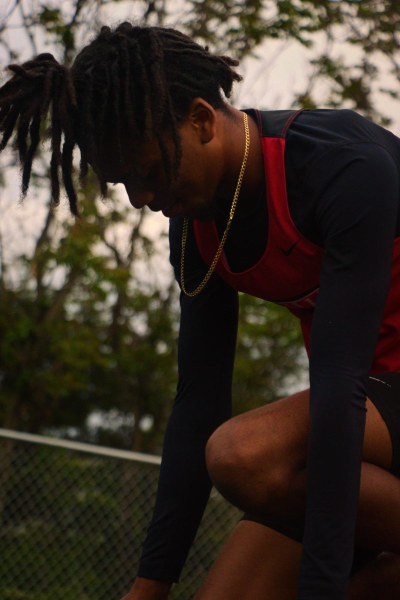 Jaleel De La Cruz  getting ready to run the 300m hurdles 