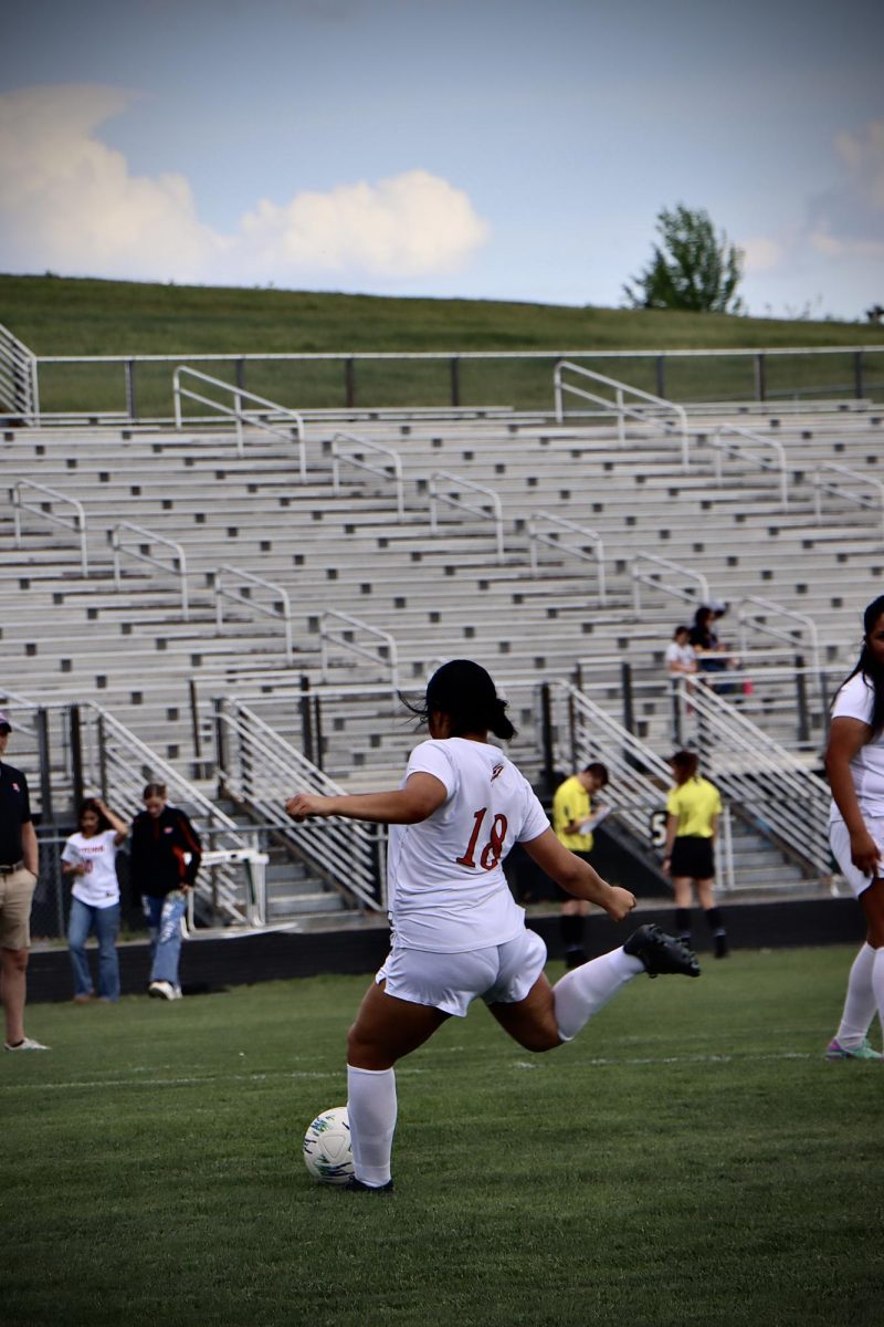 Jocelyn Hernandez practices shots and kicks during warm up before game.
