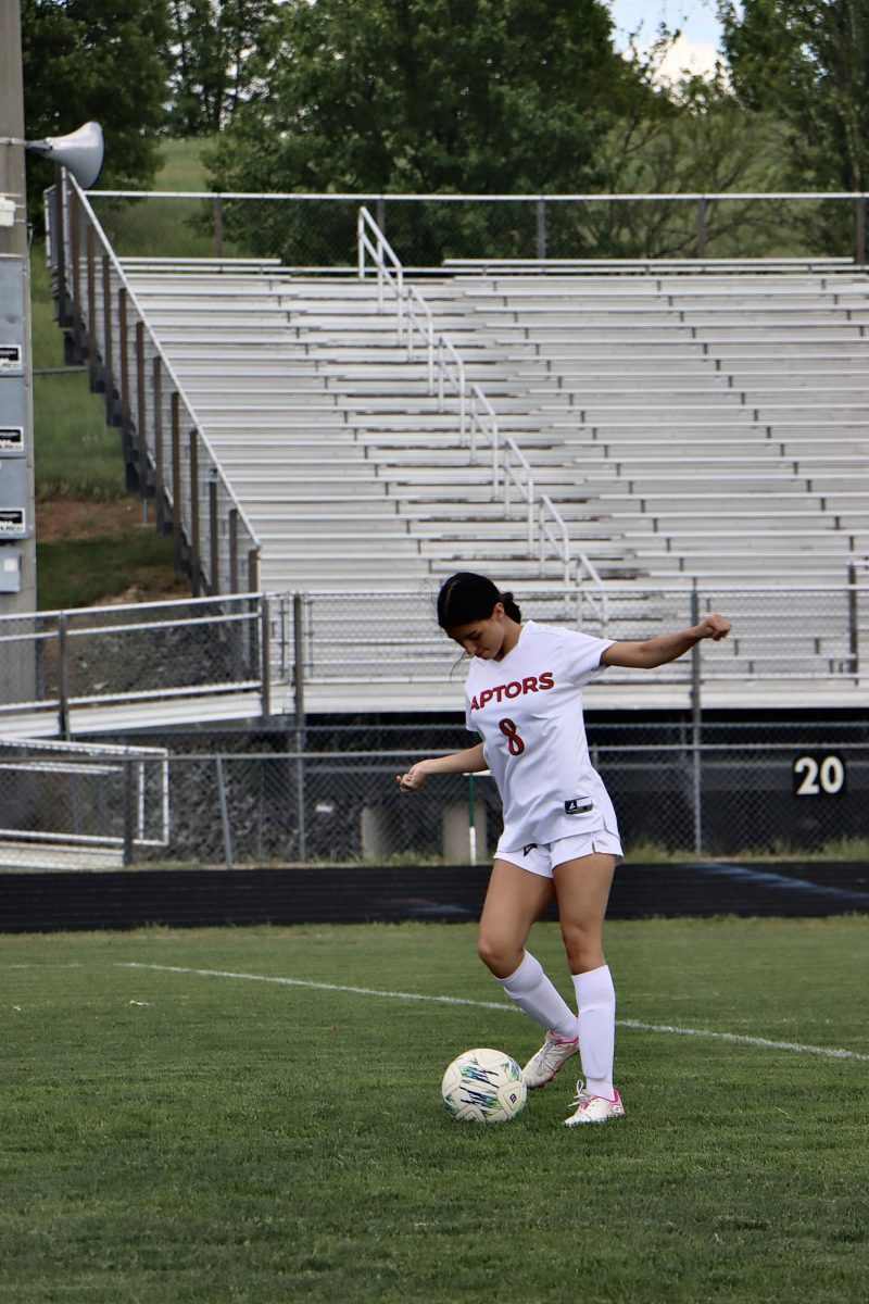 Yannalee Torres gets touch on ball before shooting in goal during warm up.