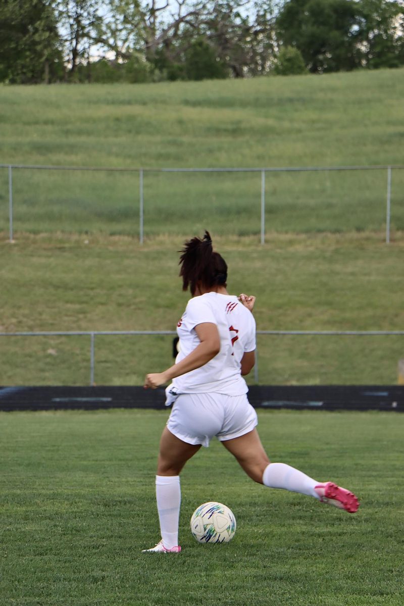 Andrea Cruz Antunez kicks ball up during warm up.