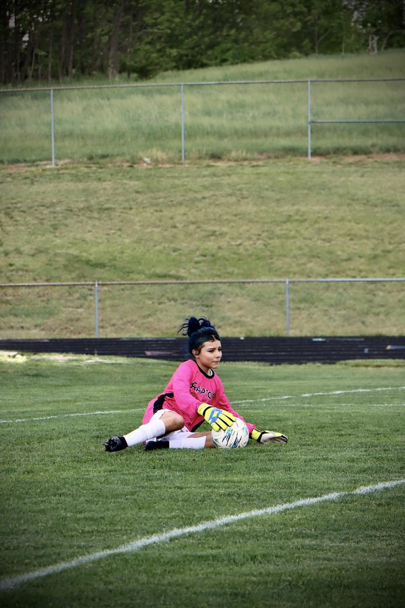 Kenia Arteaga Alvarado practices her saves with the soccer ball during warm up.