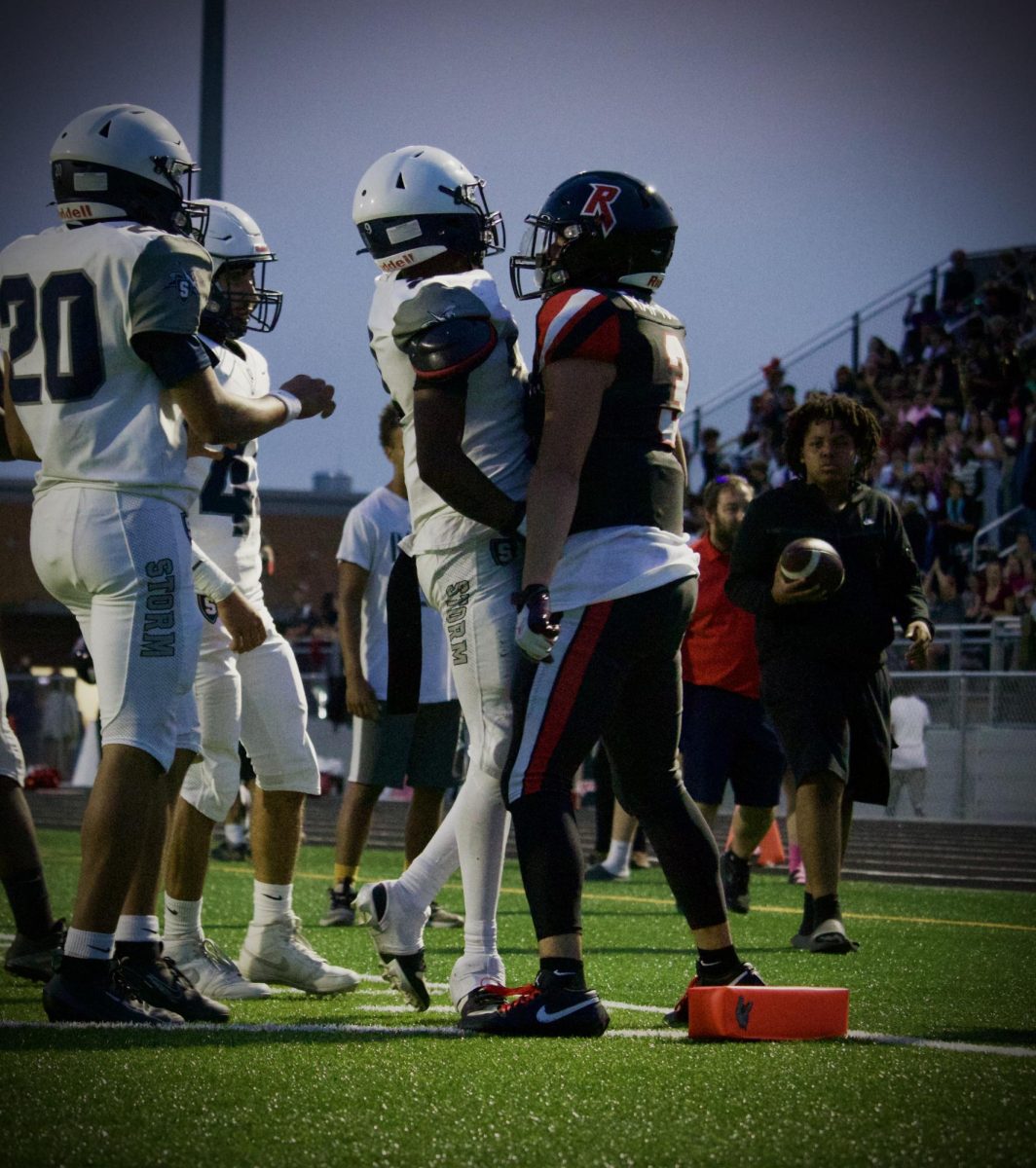 Junior Yandel Robles interacts with a player from Staunton High School on September 5 in Harrisonburg. 