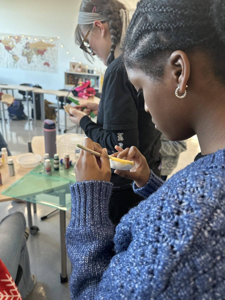 Amber Brutus is focused on painting a Diya to celebrate Diwali with the rest of ASA in November 2024. 