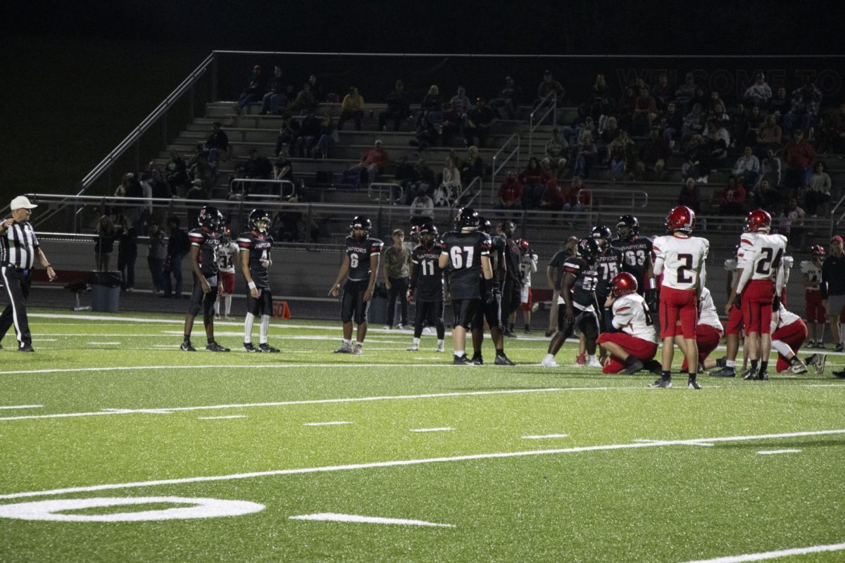 Number (67) is walking on the field.