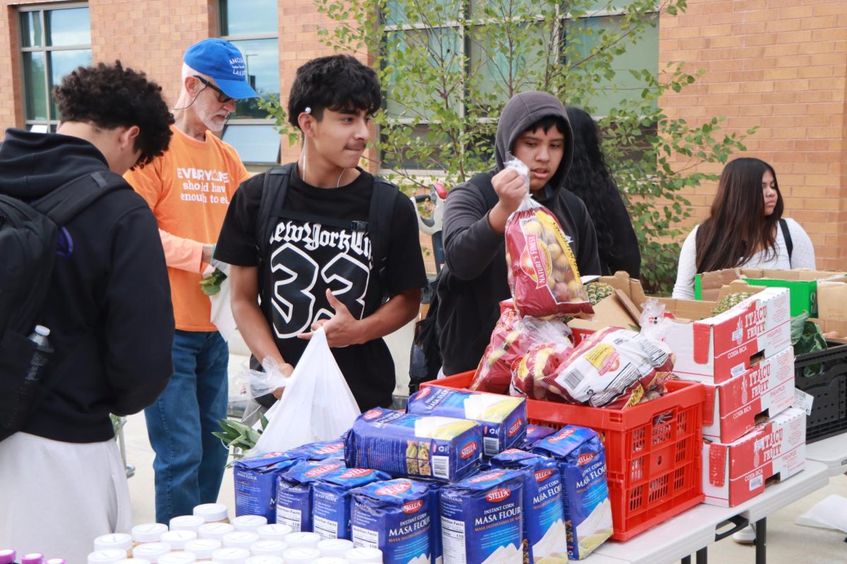 Students grab food from the Good Food School Market.