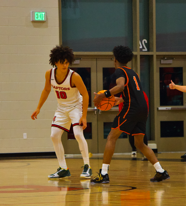 DJ Robbins playing defense against the opposing team 