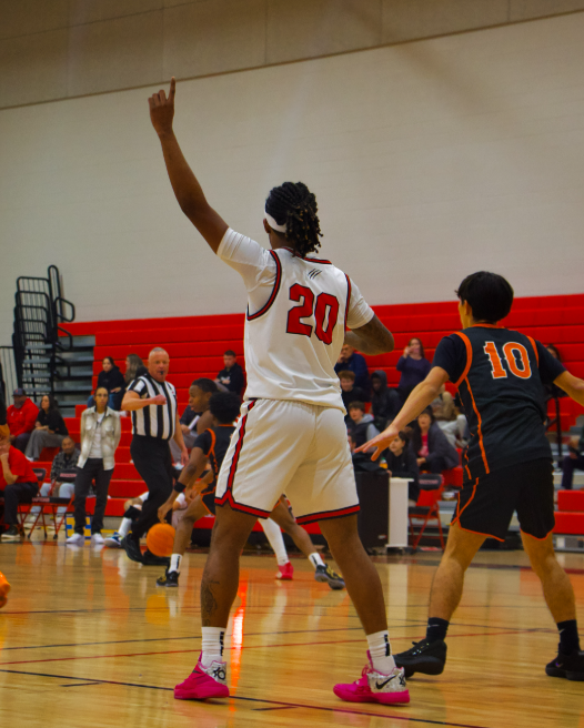 Na'im Sampson #20 is showing his teammates that hes open