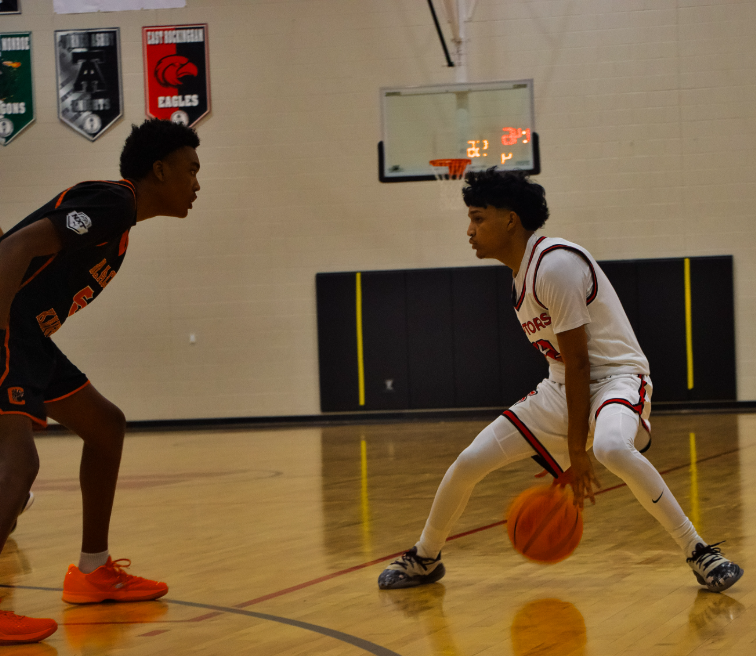 Victor Diaz-Hernandez #12 attempting to find an opening through the opposing defender 